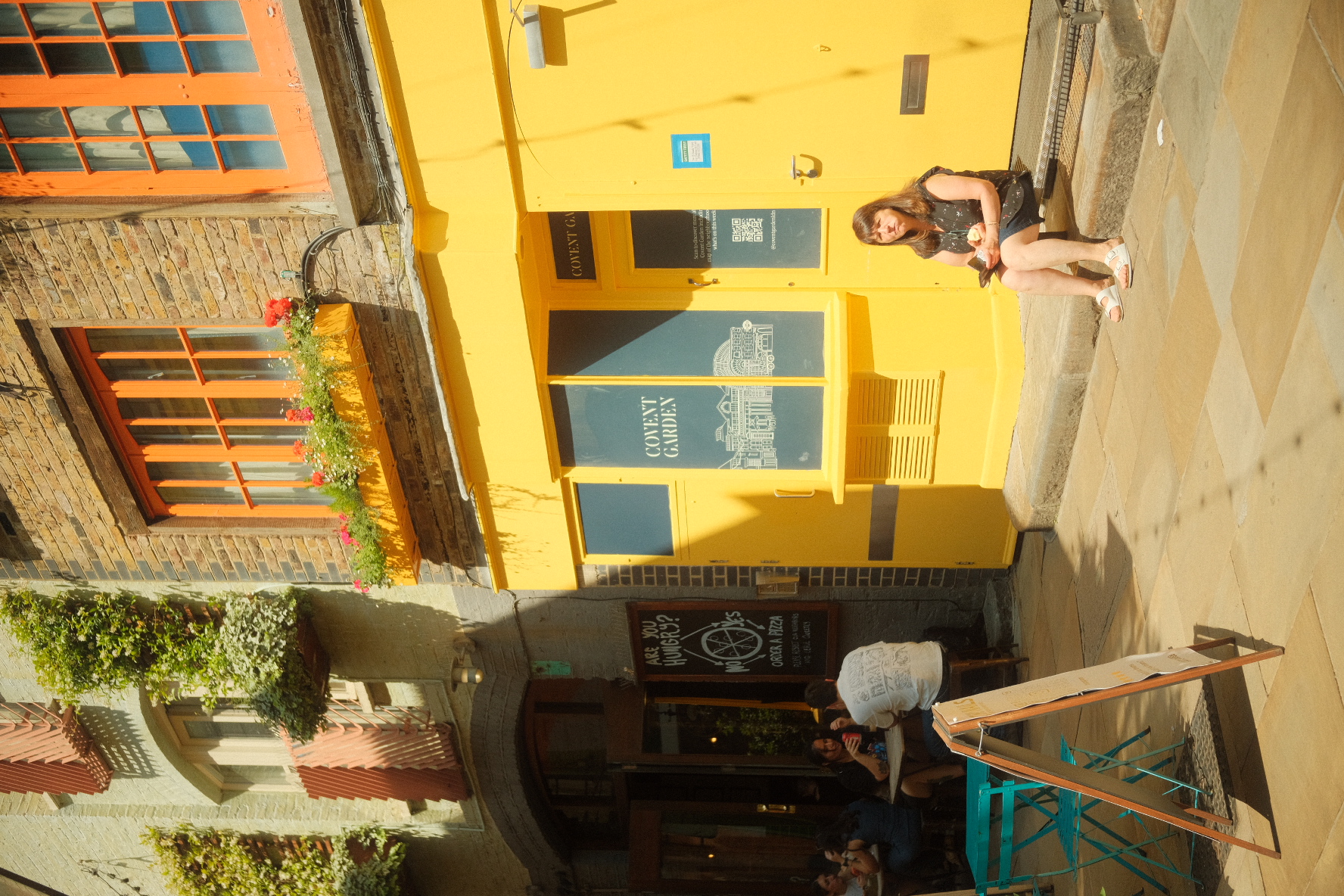 Bright yellow Covent Garden shopfront in Neal's Yard, London.