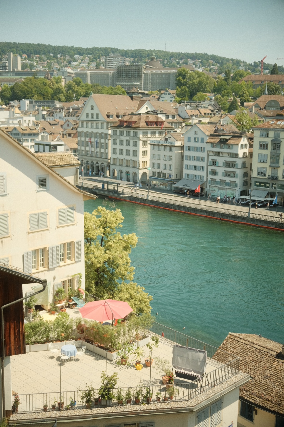 Rooftop view of Zurich's old town and the turquoise Limmat river.